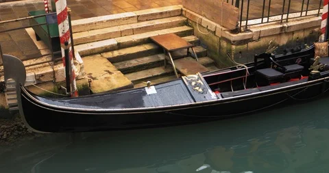 Boats float on back canals in Venice Italy. Shot filmed in 4k 2160p Stock Footage 120419683