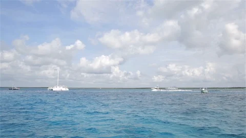 Boats float on beautiful blue waters in Cozumel, Mexico Video stock 88967385