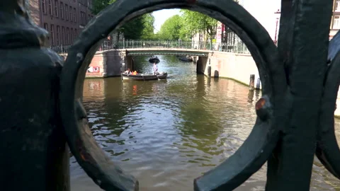 Boats float on the canal in amsterdam Stock Footage 203729495