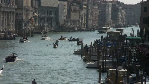 Boats float on one of many back canals in Venice Italy Video stock 127652954