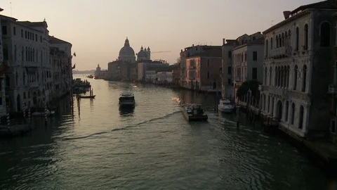Boats float on one of many back canals in Venice Italy Video stock 127653403
