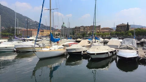 Boats float on the waters of como lake Stock Footage 118649222