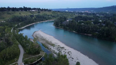 Boats floating down a river overcast aerial Stock Footage 345162102
