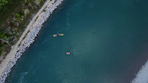 Boats floating down a river top down overcast aerial Stock Footage 345162230