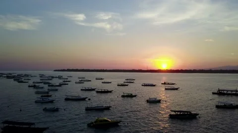 Boats floating on the lake at sunset Stock Footage 167046192