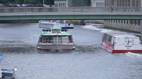 Boats floating under a bridge in Berlin Stock Footage 53250482