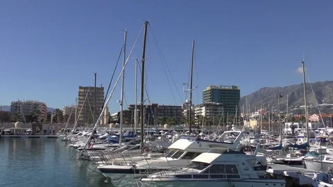 Boats harbour blue sky tracking shot Stock Footage 82574563