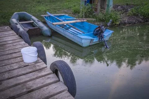 Boats at the lake pier Stock Photos