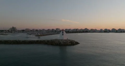Boats leaving the harbor of La Grande Motte during sunrise Stock Footage 244391653