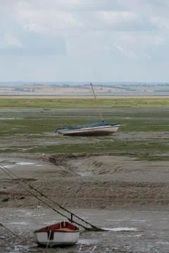 Boats in low tide Stock Photos