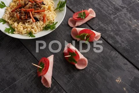 Boats meat and noodles on a plate Stock Photos