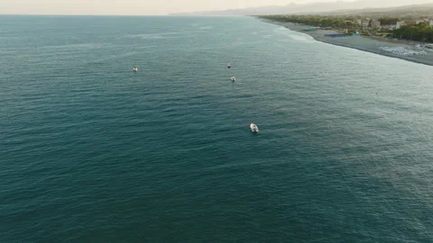Boats moored in front of the coast Видео 246496322