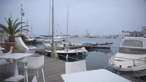 Boats moored at harbor Stock Footage 89978657