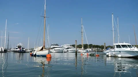 Boats moored in Lymington river, England Stock Footage