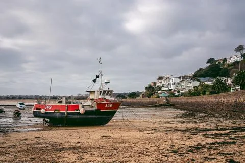 Boats moored at the seaside on cloudy day Stock Photos