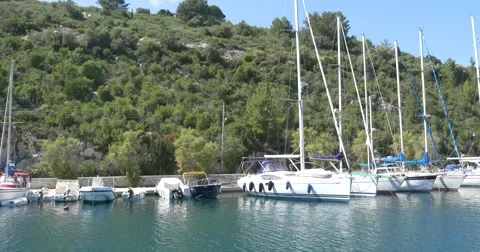 Boats moored on the shore of the island  seen on board a boat cruise Stock Footage 63297053