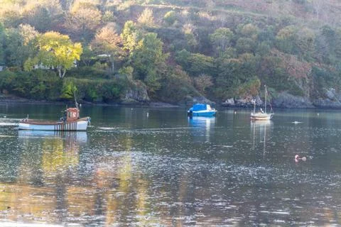 Boats moored at sunset Stock Photos