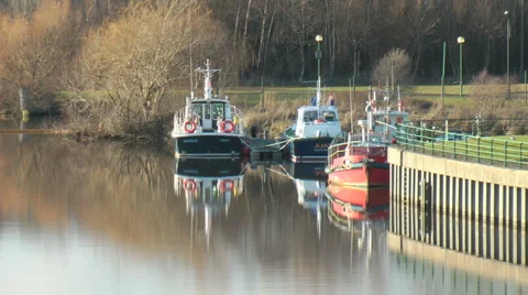 Boats moored on urban river. Stock Footage 1059435