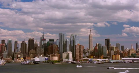 Boats move up and down Hudson River in front of New York City skyline Stock Footage 67287642