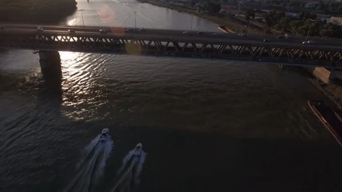 Boats moving under the bridge on river Stock Footage 120536717