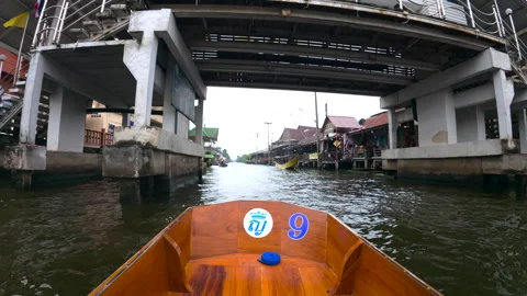 Boats navigate crowded floating  market in Bangkok Stock Footage 310097039
