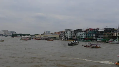 Boats navigating the Chao Phraya River in Bangkok Stock Footage 310041812