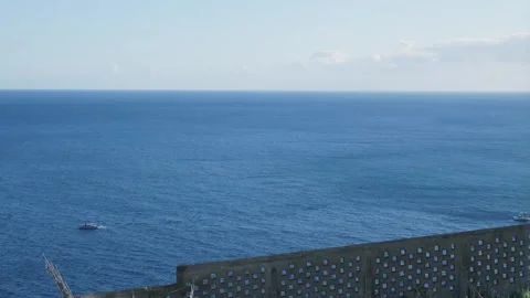Boats navigating the vast blue ocean on a sunny day Vídeo Stock 333695001