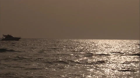 Boats pass by on the ocean in the evening. Stock Footage 46866770