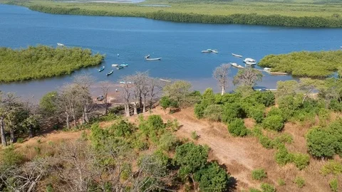 Boats on a river and lake in Senegal Africa, Drone shot over village Stock Footage