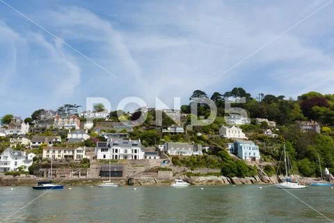 Boats on River Dart Dartmouth Devon with houses Stock Photos