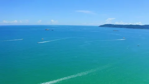 Boats sailing on a turquoise ocean under a clear blue sky 스톡 동영상 341930982