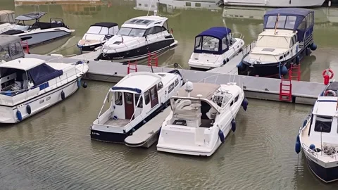 Boats stranded on dry mud and exposed riverbed due to low water level in a .. Stock Footage 345618771