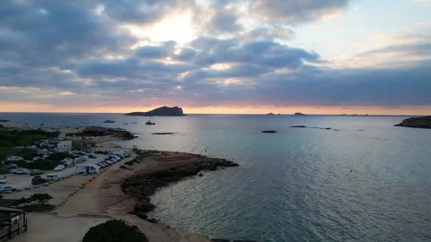 Boats at Sunset at cala comte beach, ibiza. Nice aerial view flight drone Video stock 274765300