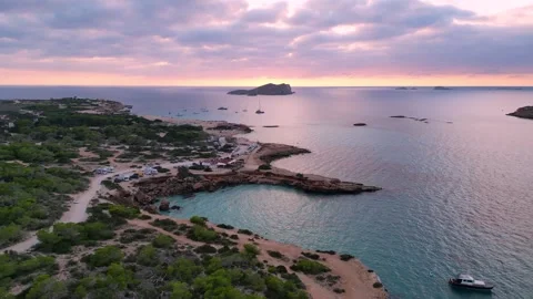 Boats at Sunset at cala comte beach, ibiza. Best aerial view flight drone Video stock 274765339