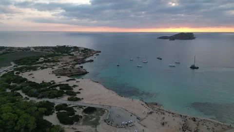 Boats at Sunset at cala comte beach, ibiza. Magic aerial view flight drone Video stock 274765392