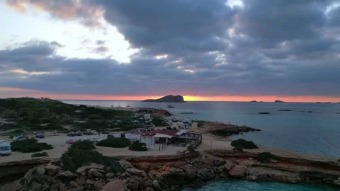 Boats at Sunset at cala comte beach, ibiza. Majestic aerial view flight drone Video stock 274765445