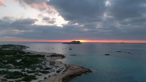 Boats at Sunset at cala comte beach, ibiza. Stunning aerial view flight drone Video stock 274765460
