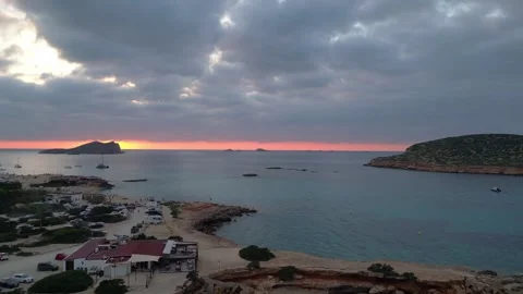 Boats at Sunset at cala comte beach, ibiza. Amazing aerial view flight drone Video stock 274765497