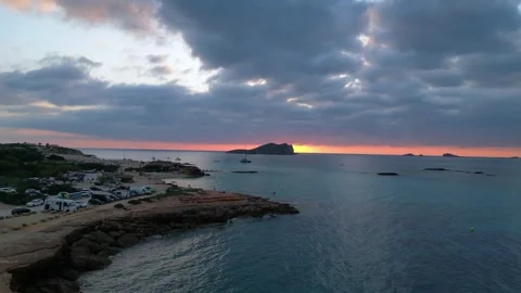 Boats at Sunset at cala comte beach, ibiza. Beautiful aerial view flight drone Video stock 274765551