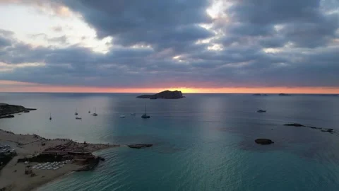 Boats at Sunset at cala comte beach, ibiza. Spectacular aerial view flight drone Video stock 274765602