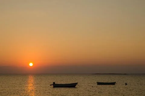 Boats at sunset Stock Photos