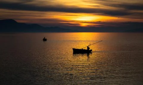 Boats at sunset Stock Photos