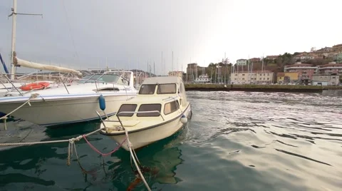 Boats swing on the waves in the Harbor Video stock 60231147