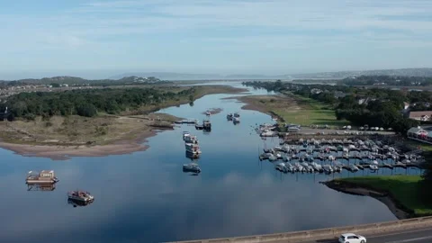 Boats under bridge over river aerial wide Video stock 329105248