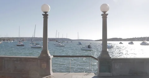 Boats on the water through lamp posts Stock Footage 91471563