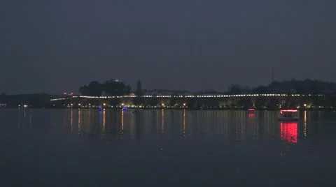 Boats on Xuanwu Lake in twilight, Nanjing, China Stock Footage