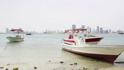 Boatyard with Muharraq skyline in the background Stock Footage 137144398