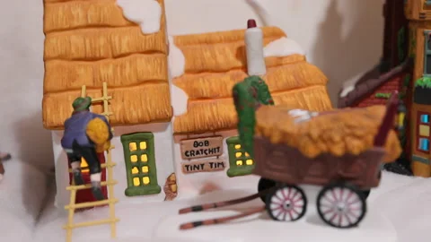 Bob Cratchit and Tiny Tim's House in a Dickens Village Christmas village Stock Footage 146566226