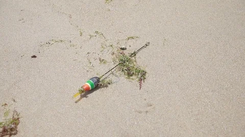 Bobber lying in the sand Stock Footage 111432762