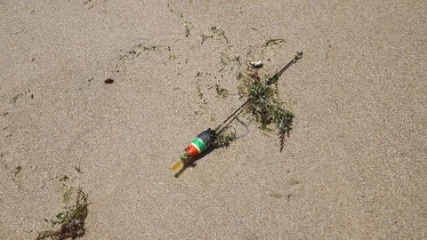 Bobber lying in the sand Stock Footage 111432813